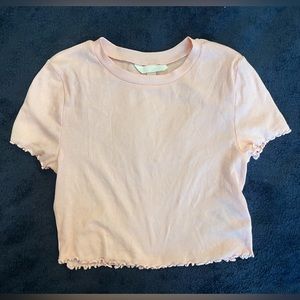 baby pink cropped T-shirt. Ribbed with small ruffles by sleeves and bottom.